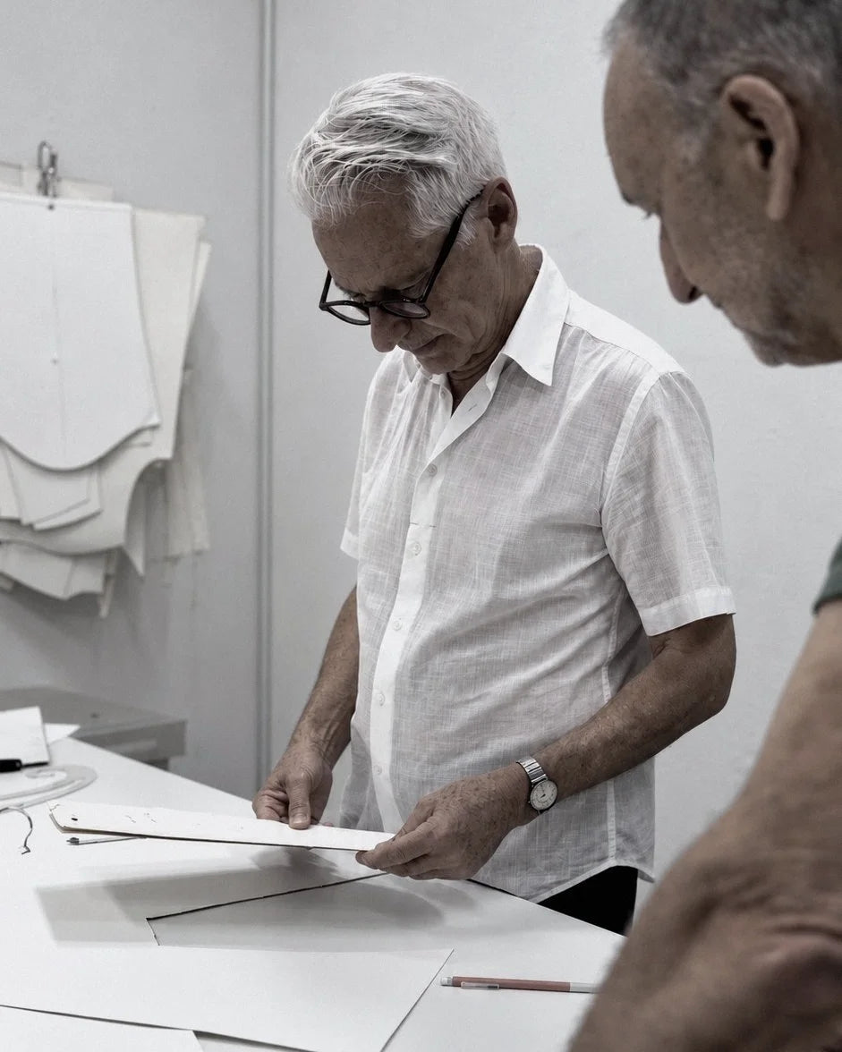 Two pattern masters checking a card pattern at the Paris table